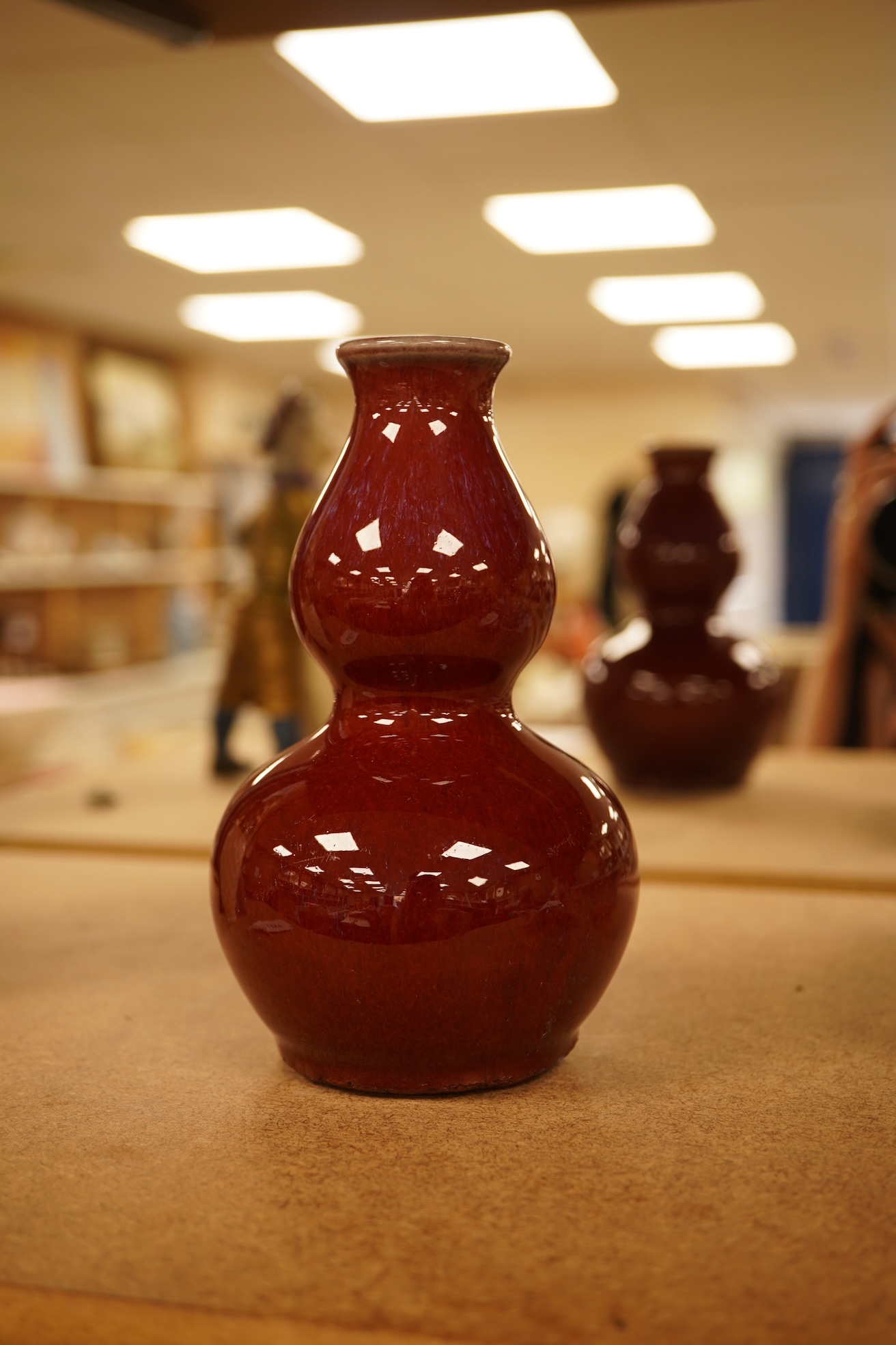 A Chinese Sang De Boeuf glazed double gourd vase, 14.5cm high